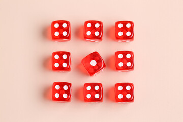 Red game dices on beige background
