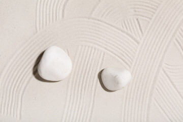 Spa stones on light sand. Zen concept