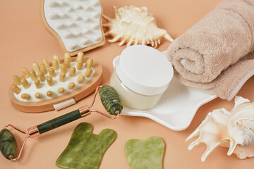 composition with massage tools and bath supplies on beige background