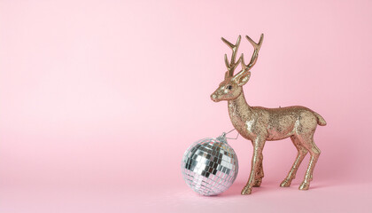 Golden reindeer with disco ball on pastel pink background