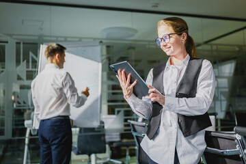 Business professionals collaborate in a modern office setting as they engage in a strategic meeting...