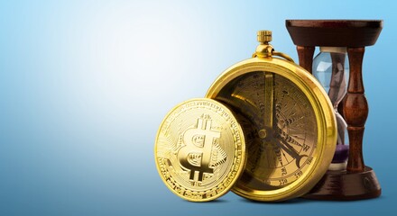 Physical version of gold cryptocurrency Bitcoin and hourglass