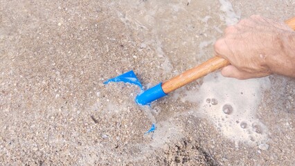 Children digging in the sand at the beach