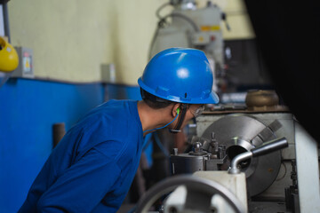 industrial worker operating a machine