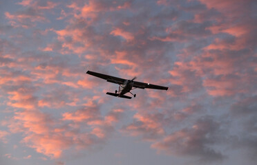 Light Plane Cruising Through Vibrant Twilight Skies