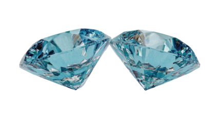 Two light-blue, cut diamonds, side-by-side, against a black background.  Detailed facets and reflections are visible