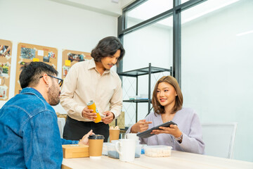 Obraz premium Corporate business team meeting discussion with project manager in office conference room. Man and woman creative teamwork production planning reusable Eco friendly product for sustainable living.