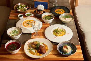 A Delicious and Colorful Assortment of Gourmet Dishes on a Beautiful Wooden Table