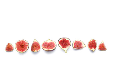 Cut fresh ripe figs on white background