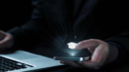 Close-up view of hands holding a smartphone displaying educational icons. A laptop is in the background, illustrating the connection of technology and online learning in modern education. Qubit