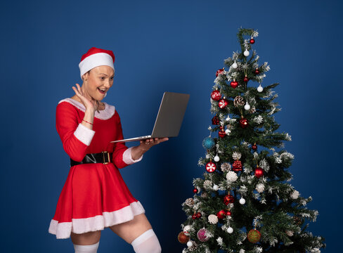 Santa woman having video call celebrating christmas online