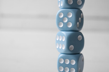 Stack of blue game dices on white background