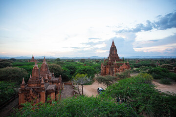 Sunset Over the Sacred Plains: A Panoramic View of Ancient Pagodas and Temple Ruins in Bagan, Myanmar