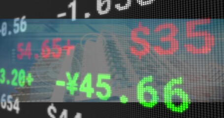 Displaying LED ticker display scrolling stock market numbers over urban area with skyscraper facade