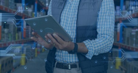 Warehouse supervisor holding tablet checking inventory in aisle, with overlaid digital graphics