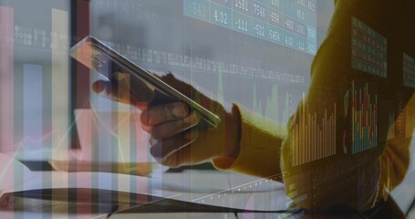 Analyst holding smartphone and viewing laptop screen in office, with notebook and chart overlays