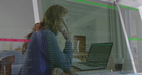 Leaning woman programmer studying laptop screen at modern office, with coffee cup and code overlay