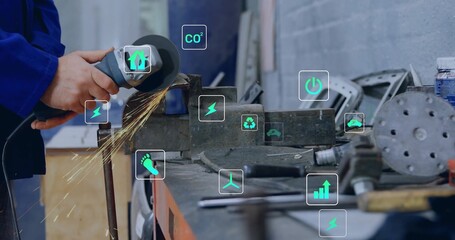 Metalworker hands grinding steel with angle grinder in machine shop, with digital icons, copy space