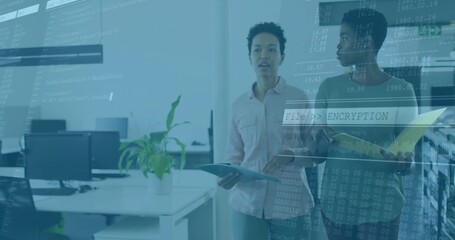 Two IT colleagues analyzing encryption code in modern office, with laptop and folder, copy space