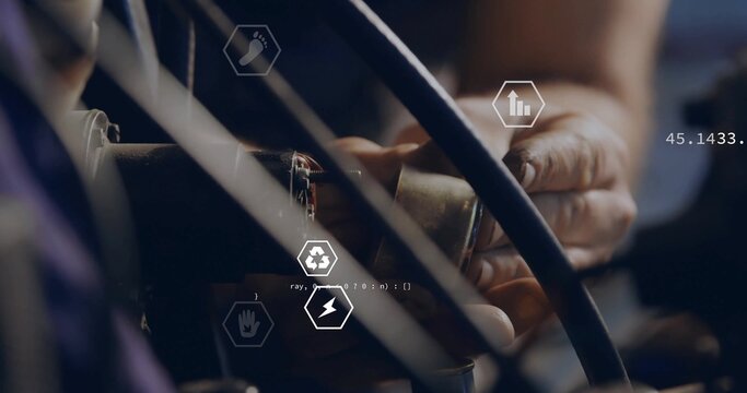 Operating technician hands connecting connector to cable bundles in workshop, with digital overlays