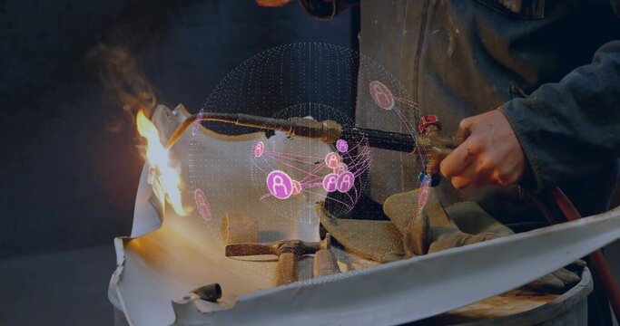 Gloved hands slicing curved metal sheet using oxy-fuel torch in workshop, with holographic network - Powered by Adobe