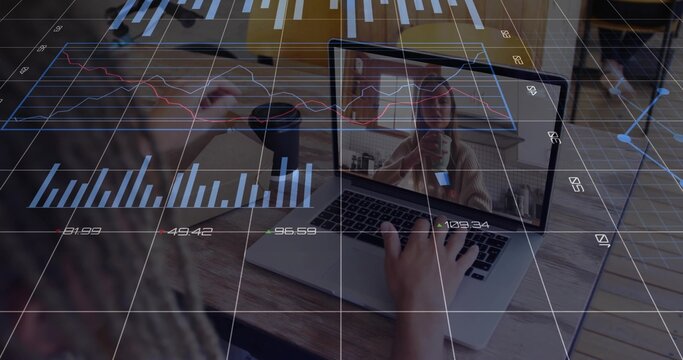 Woman holding coffee mug, typing on laptop at home office table with financial charts during call - Powered by Adobe