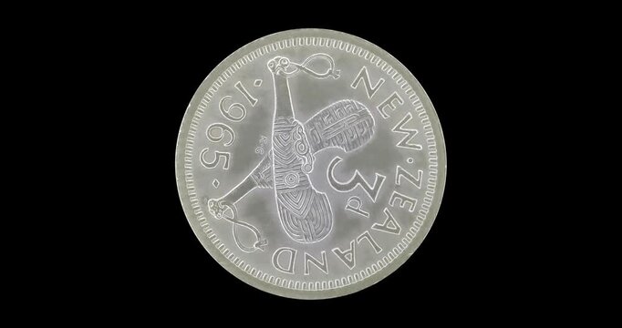 Reverse of old New Zealand coin 3 pence 1965, isolated in black background. Loopable animation in 4k resolution video.