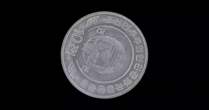 Obverse of North Korea coin 10 chon 2022, isolated in black background. Loopable animation in 4k resolution video