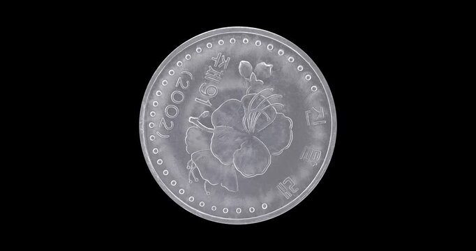 Reverse of North Korea coin 10 chon 2002, isolated in black background. Loopable animation in 4k resolution video