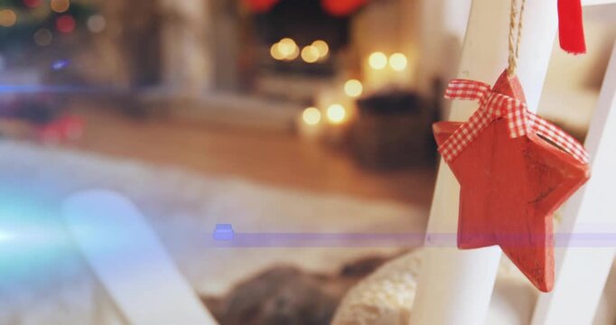 Camera panning right revealing red gingham star ornament hanging from ladder over blurred mantel