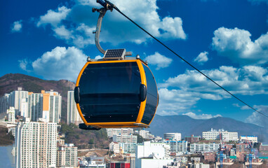 The cable car on blue sky with clouds in Busan, South Gyeongsang Province, South Korea.