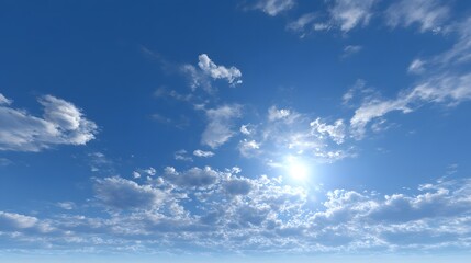 Obraz premium Bright sun shines through scattered white clouds in a clear blue sky.