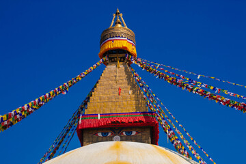 Spiritual Colors: The Magnificent Boudhanath Stupa with Fluttering Prayer Flags in Kathmandu, Nepal