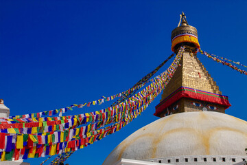 Spiritual Colors: The Magnificent Boudhanath Stupa with Fluttering Prayer Flags in Kathmandu, Nepal