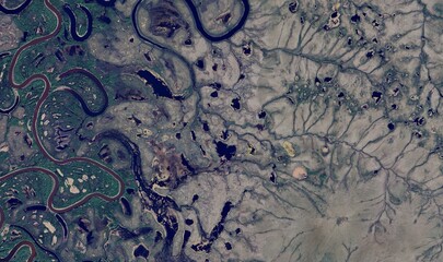 Alaskan River Landscape: High-Resolution Aerial View of Braided River Systems, Tundra, and Mountain...