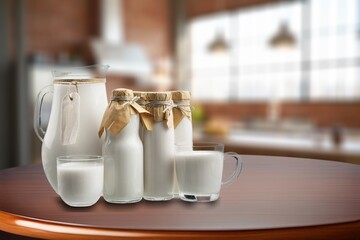 A glass of tasty fresh milk on the desk