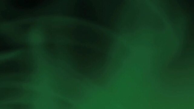 Abstract swirling green smoke or gas against a dark background.
