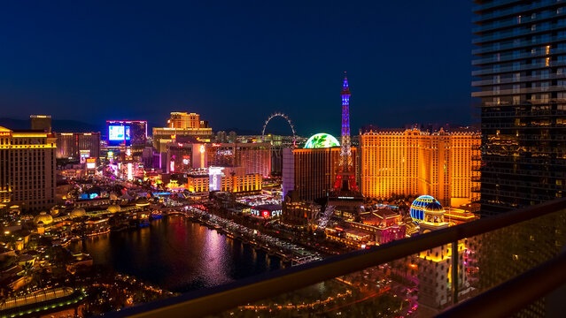 Aerial view of vibrant Las Vegas Strip at night showcasing iconic landmarks and colorful lights with copy space for design