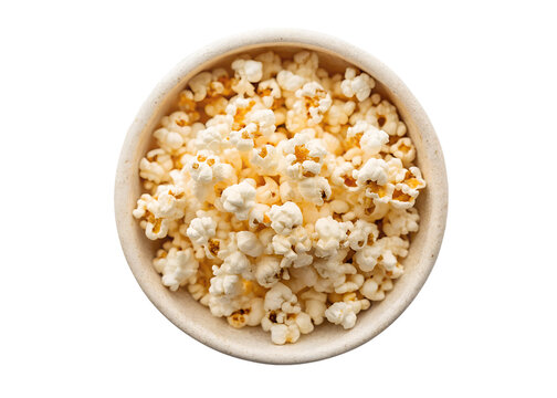 A top down view of a light brown bowl filled with freshly popped popcorn and a few pieces of white marshmallow on a black background