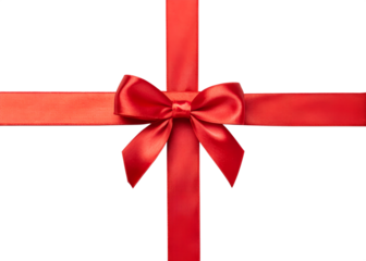 Elegant red satin ribbon bow tied in a cross shape on a black background for gift wrapping and celebrations