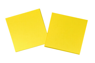Two bright yellow blank sticky notes side by side on a dark surface