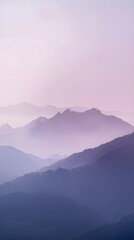 Fototapeta premium Misty mountain landscape at sunrise with forest and clouds