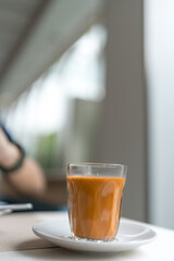 a traditional hot milk tea, is a beloved breakfast beverage in thailand known for rich flavor.