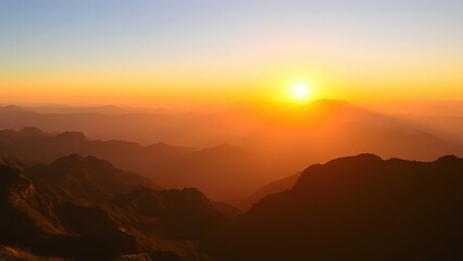 Obraz premium Golden sunrise over vast mountain peaks, creating a peaceful and expansive natural panorama.