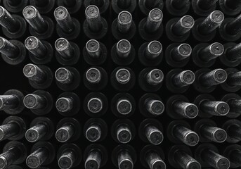 Mysterious Array of Bottled Treasures: A captivating overhead view showcases rows of elegantly arranged, dark-colored bottles, hinting at an array of carefully curated contents. The composition.