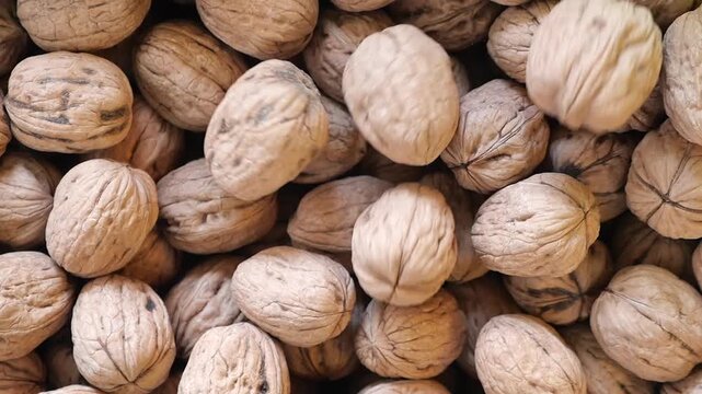 top view of walnuts drops in a bowl 