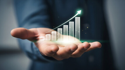 Hand holding a rising financial growth chart