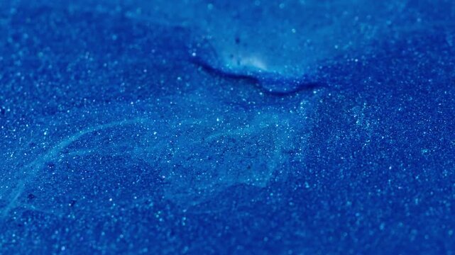 Paint splotch. Pigment spill. Blue sparkling enamel art blend white acrylic flow. Color dissolve abstract emulsion defocused background.