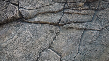 Textured Stone Wall with Irregular Cracks