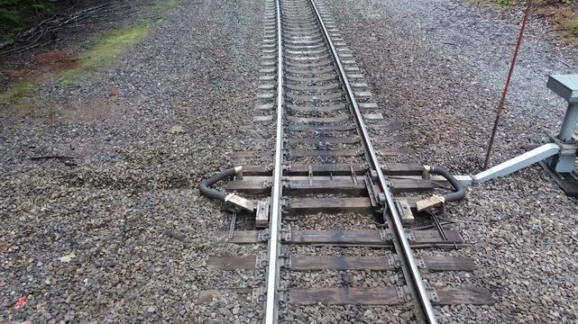 Railroad wheel heating equipment near the Foss Creek bridge in Washington. Flight travels straight over the equipment showing the ducting and control system.